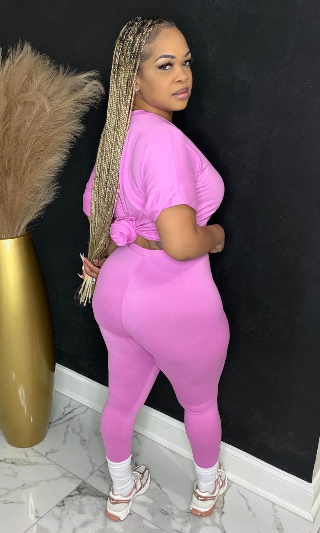 Model wearing Basic Set Candy Pink in size medium, back view highlighting high-waisted leggings and fitted top.