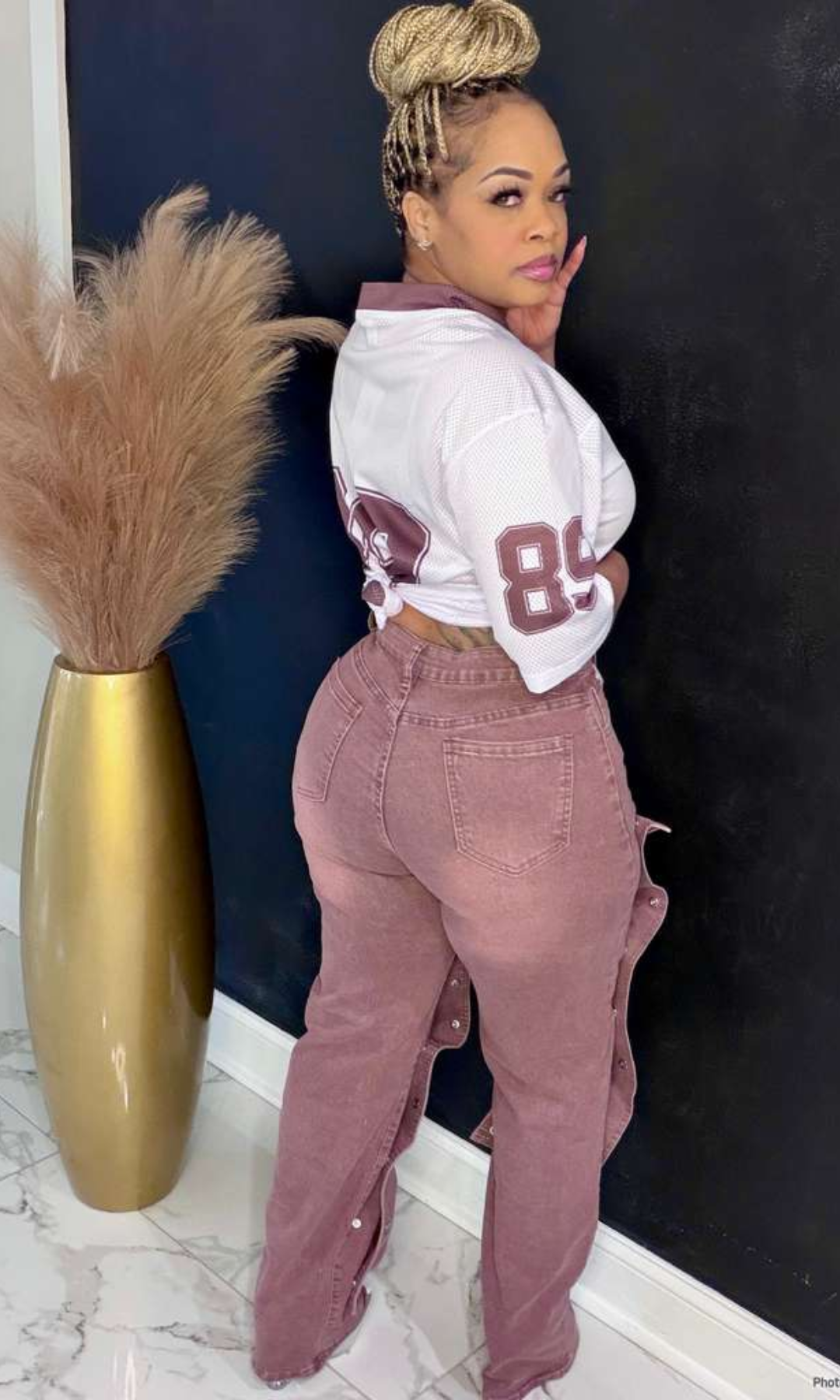 Close front view of Boss Energy Snap Jeans styled with cropped jersey top and heels.