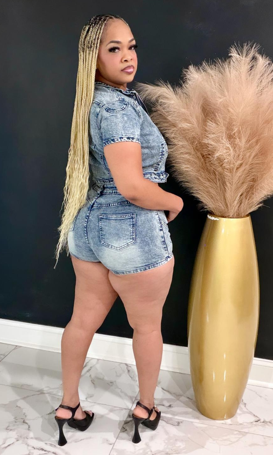 Denim Hottie two-piece set featuring a cropped zip-front denim jacket, high-waisted shorts, and a flattering acid-wash finish for an effortlessly stylish look.