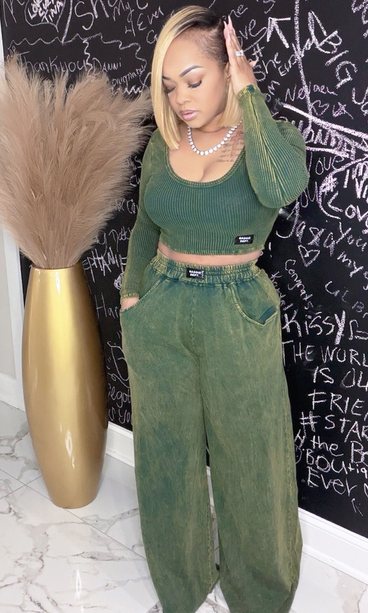 Woman wearing Envy Unbothered Set with ribbed green crop top and wide-leg pants, front view