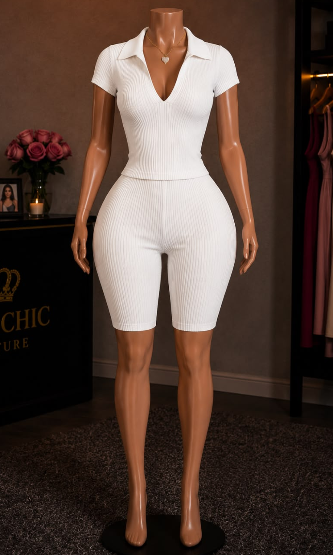 Women's off white two-piece matching set with a collared V-neck short-sleeve top and high-waisted biker shorts.