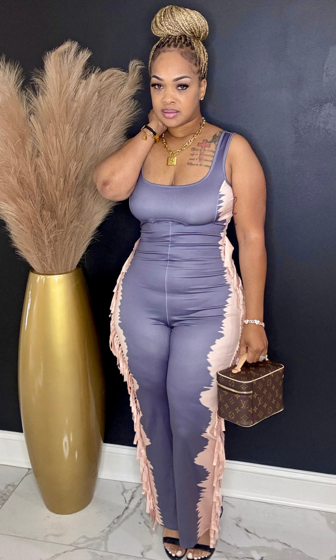 PG Romper Jumpsuit front view – Model in medium size showing sleeveless jumpsuit with side fringe detail.