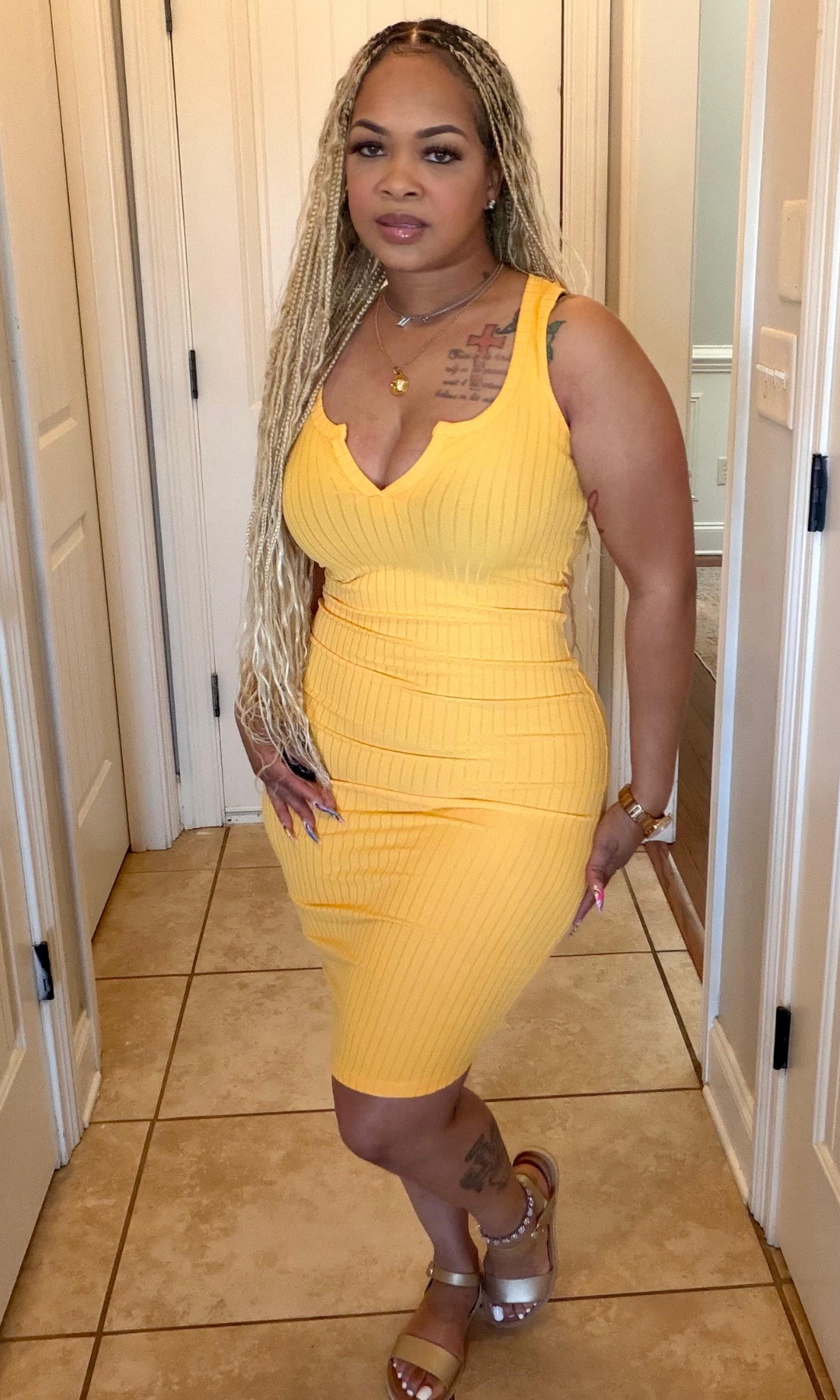 Sleeveless yellow midi dress with ribbed texture and stretch fit