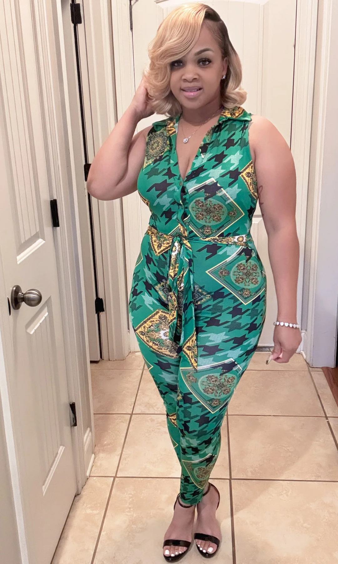 Front view of woman wearing Sexy Green Jumpsuit with tie-front waist.