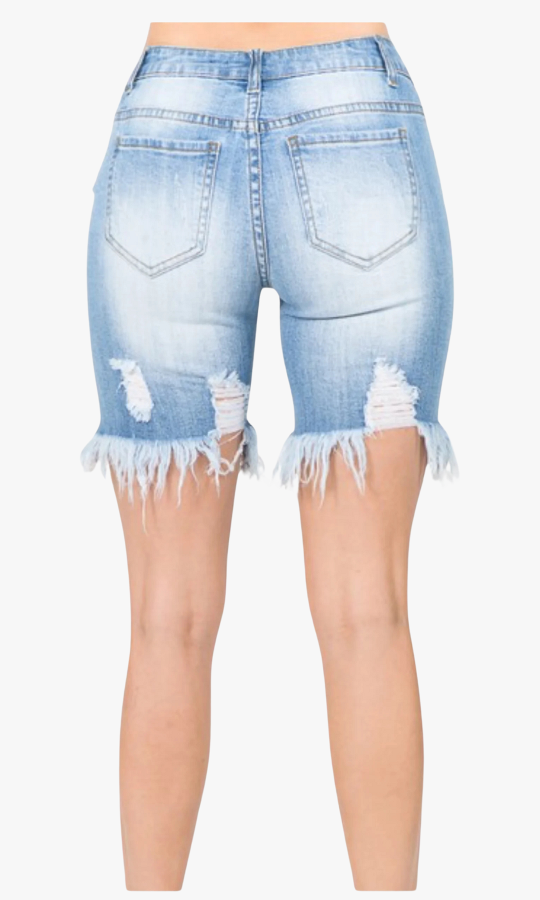 Close-up back view of woman wearing Tight Fit Ripped Shorts in light blue denim with rear distressing, frayed hems, and classic back pockets.