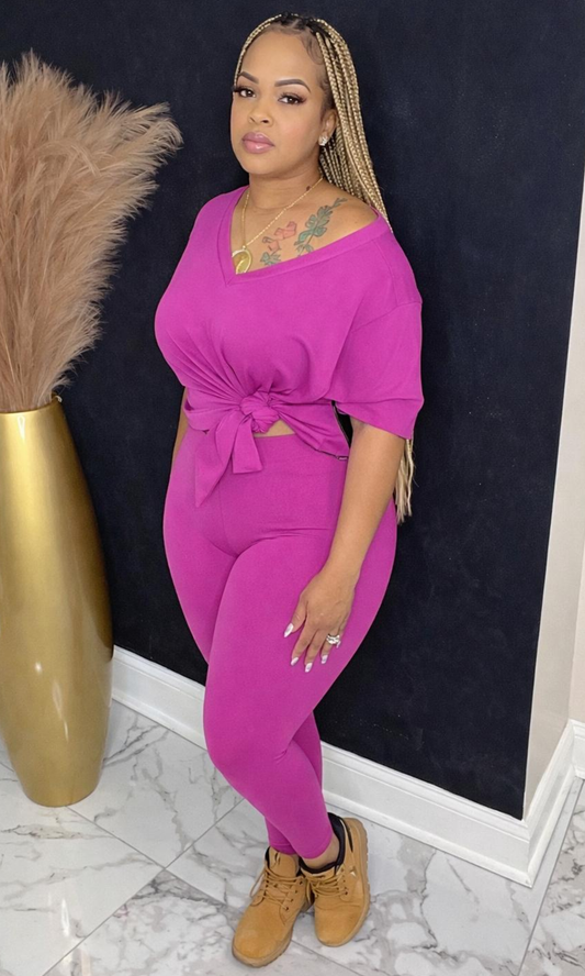 Model wearing Basic Set Bright Mauve in size medium, front view styled with boots, featuring high-waisted leggings and knotted top detail.