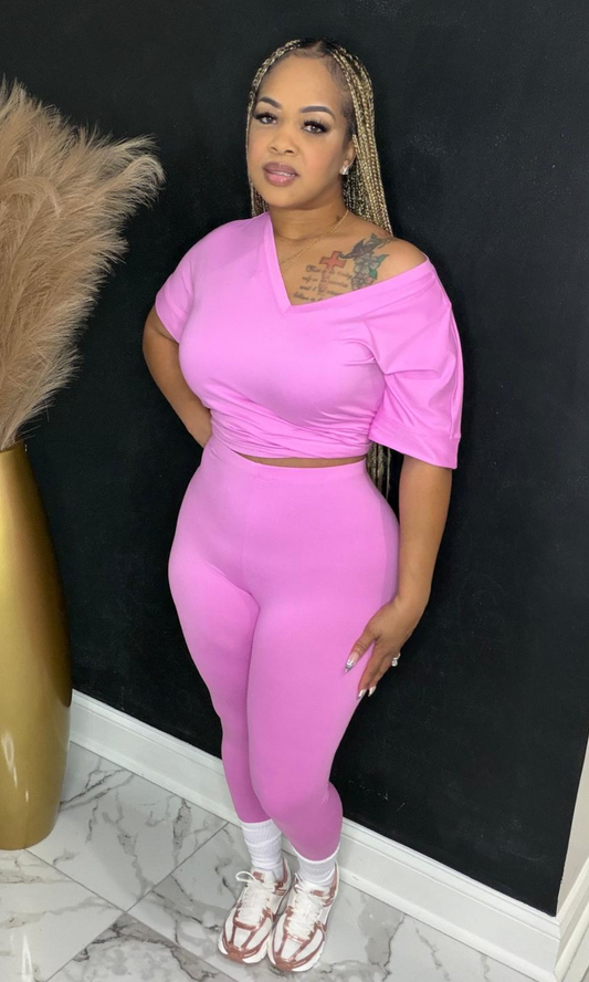 Front view of Basic Set Candy Pink two-piece set styled with sneakers.