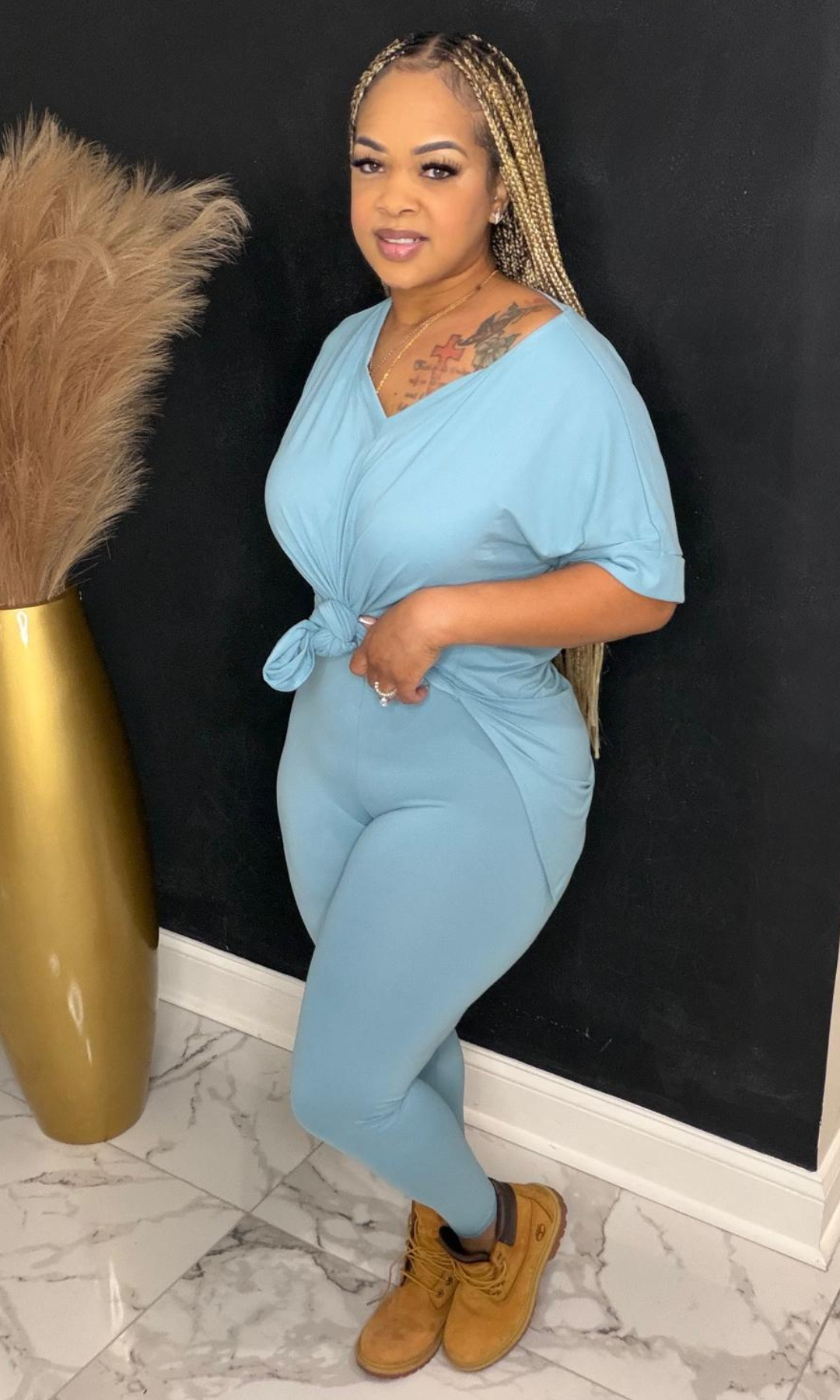 Model wearing Basic Set Dusty Teal in size medium, front view styled with boots.