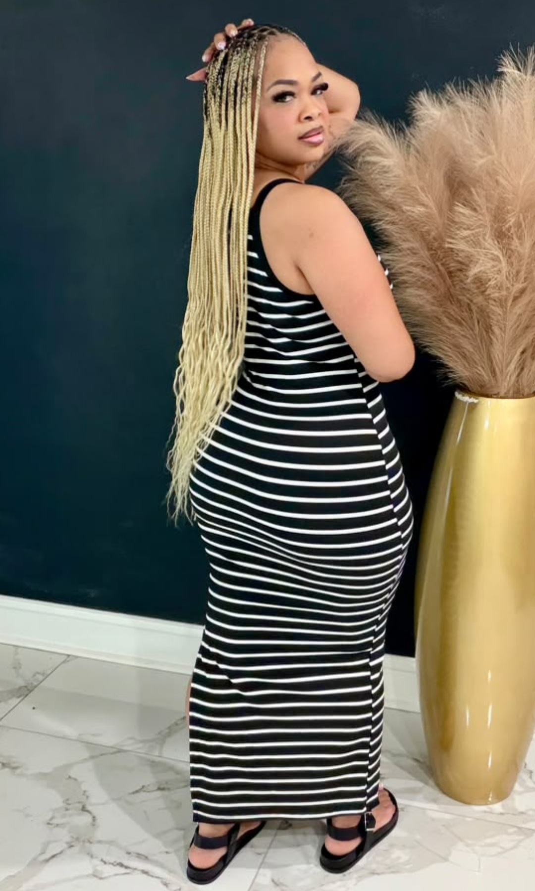 The Basic Striped Maxi Dress combines timeless black and white stripes with a soft stretch fit and flattering silhouette for effortless everyday style.