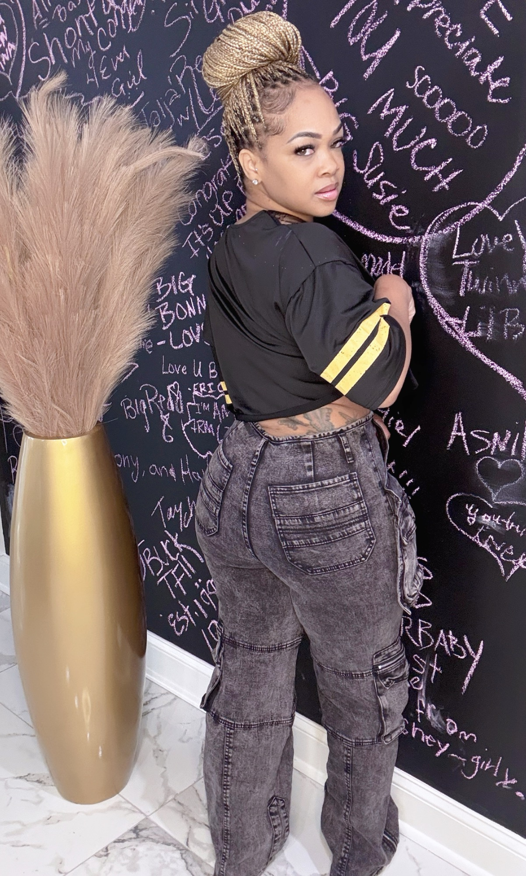 Black Acid Cargo Jeans – Back View – Back angle of black acid wash cargo jeans showing pocket and seam details.