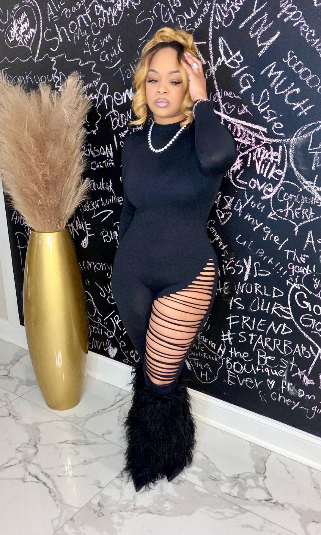 Black Cat black jumpsuit front view with leg cutout detail