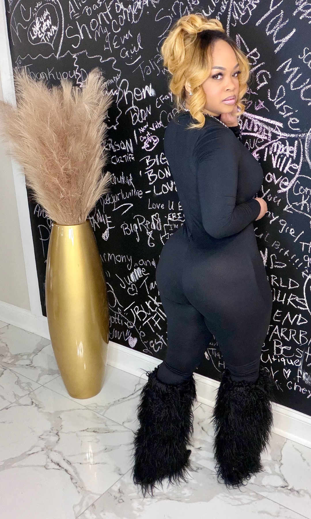 Black Cat fitted jumpsuit back view showing stretch and silhouette