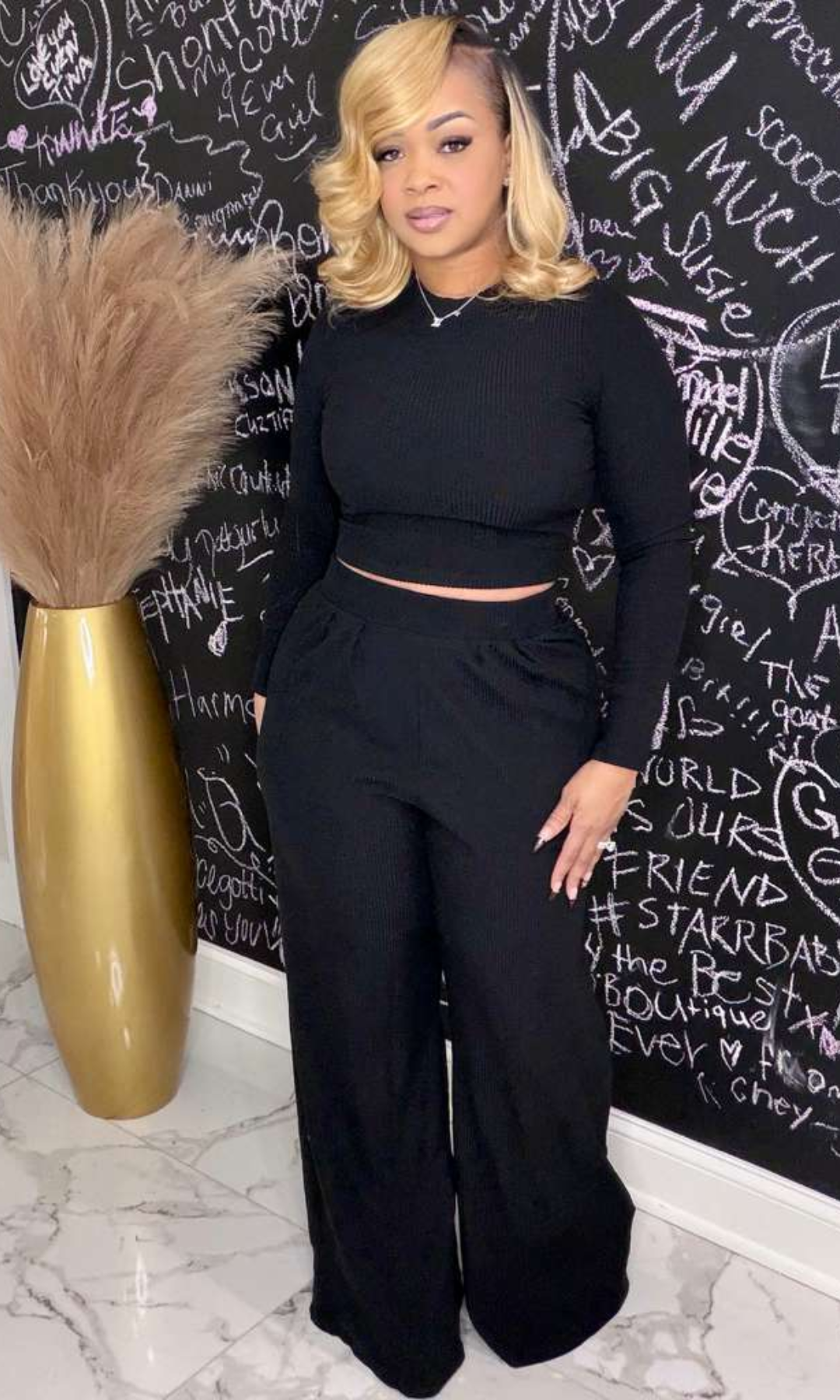 Model wearing Black Julia Set with long-sleeve crop top and wide-leg pants