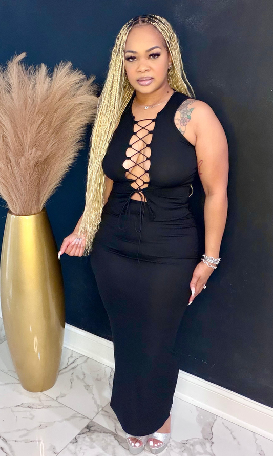 Black tie two piece skirt set front view showing lace-up detail top and fitted midi skirt