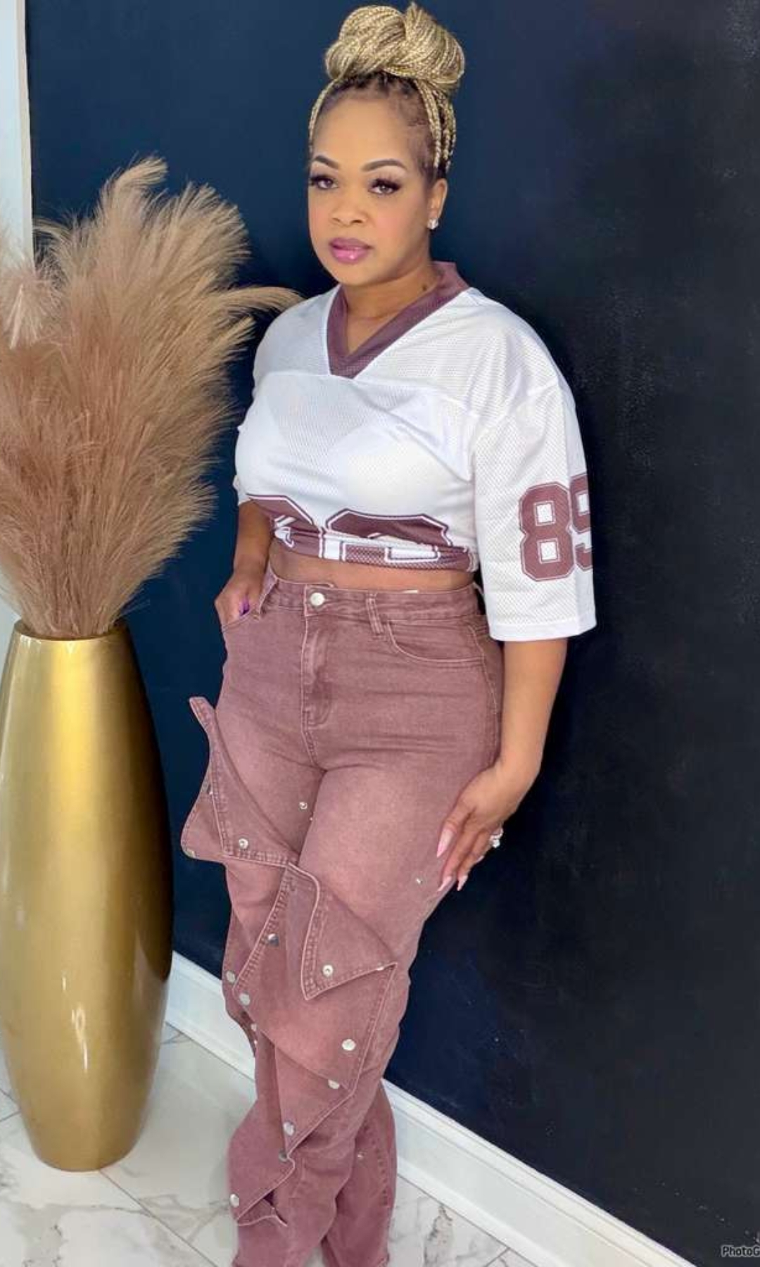 Model wearing Boss Energy Snap Jeans in size medium, back view showing high-waisted fit and mauve wash.