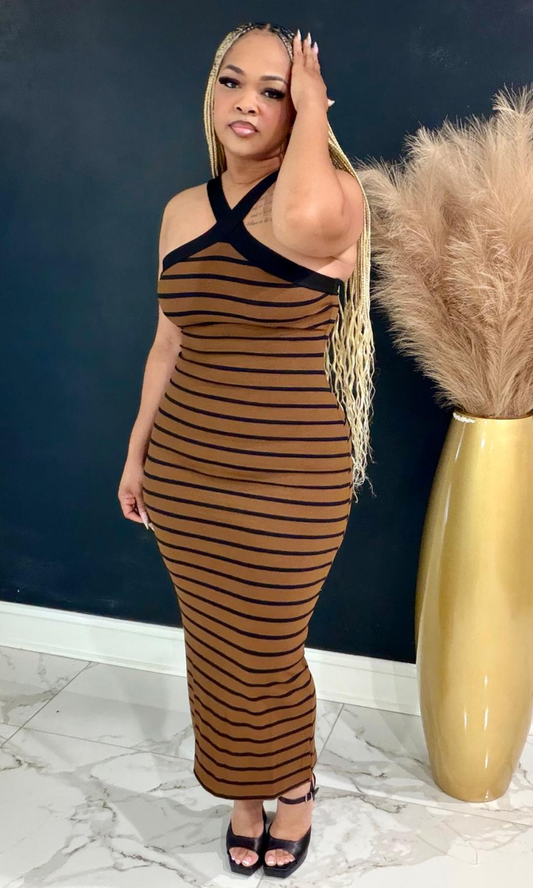 Woman wearing the Brownie striped bodycon maxi dress with a crisscross halter neckline and flattering fitted silhouette.