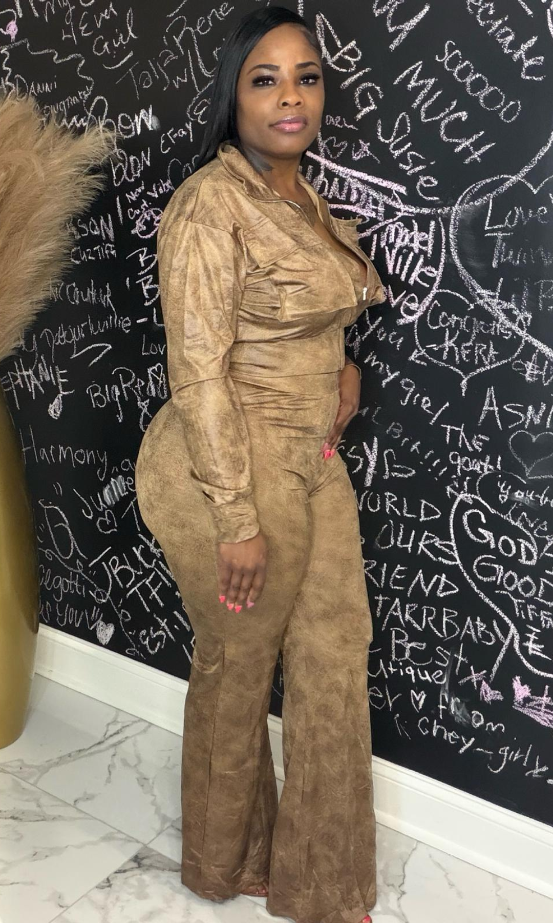 Close-up of cocoa suede-like fabric texture on utility pant set