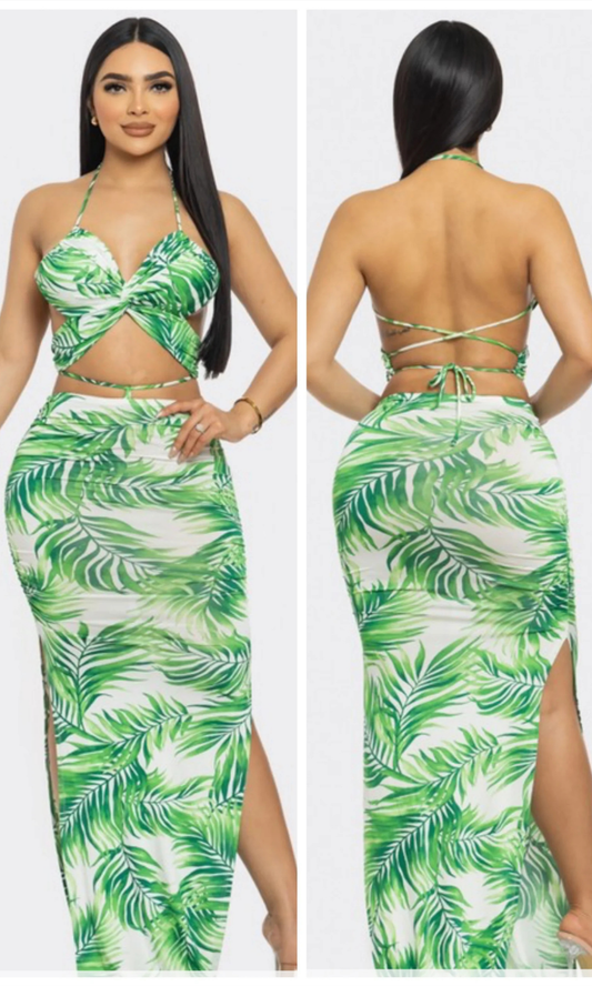 Green leaf-patterned outfit worn by a model on a white background