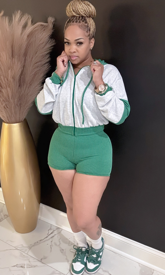 Woman wearing Green Lucky Charm 2-piece set, front view with hoodie.
