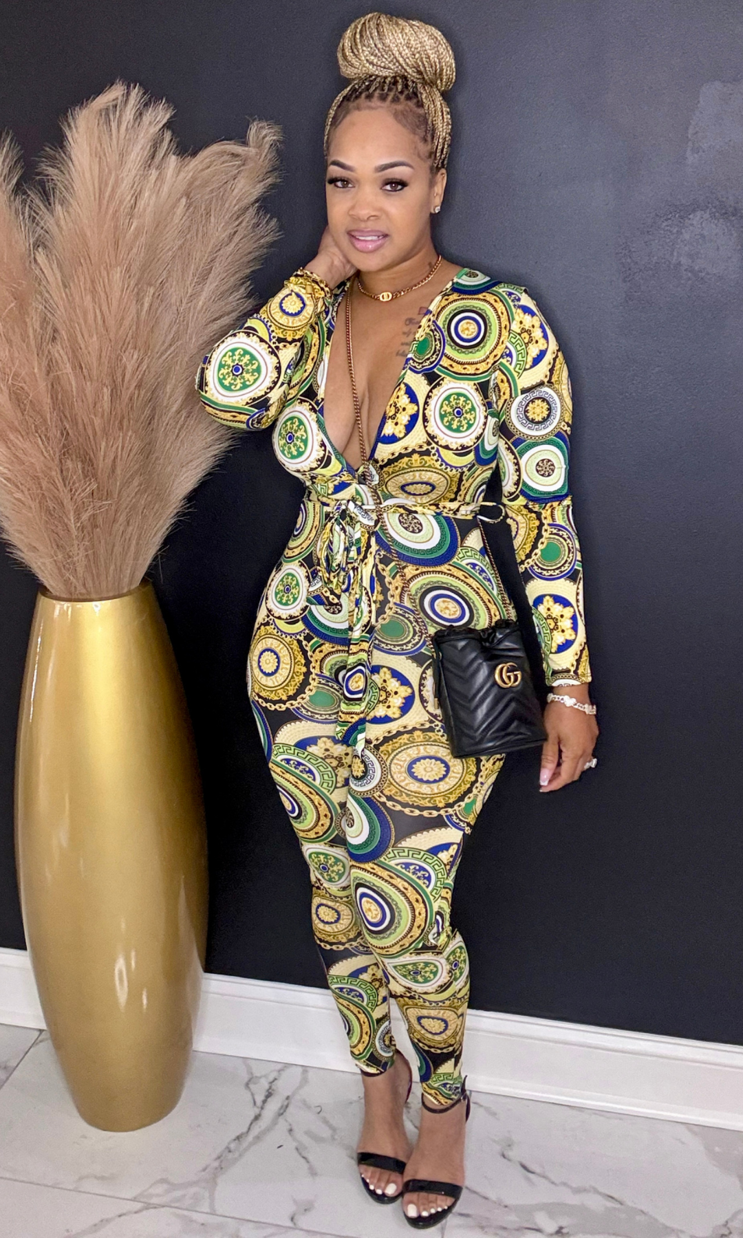 Full-body side angle of Green & Gold Lux printed jumpsuit