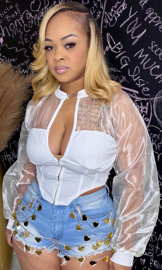 Model wearing Heart Desire Shorts with light-wash denim and heart charm chain detailing