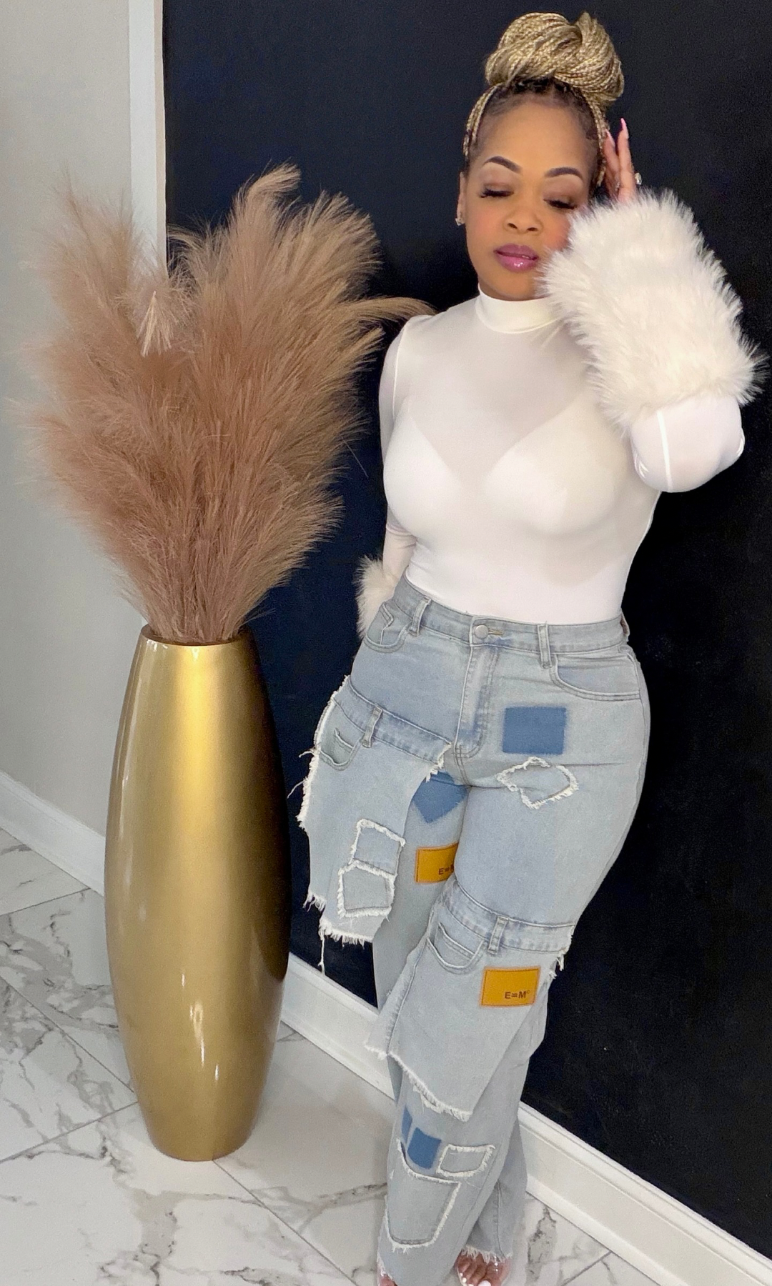 Model wearing Patchwork Power Jeans in size medium paired with a fitted white top, front view.