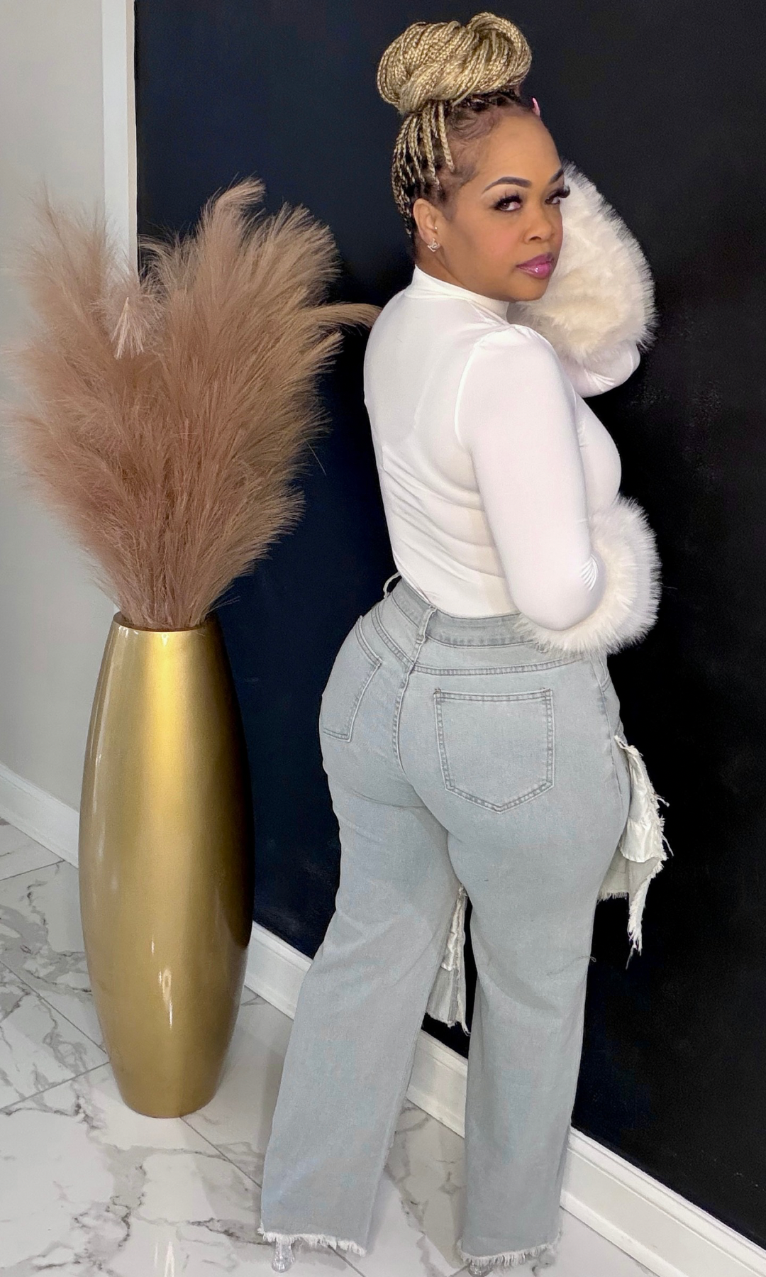 Back view of Patchwork Power Jeans highlighting high-waisted fit and wide leg silhouette.