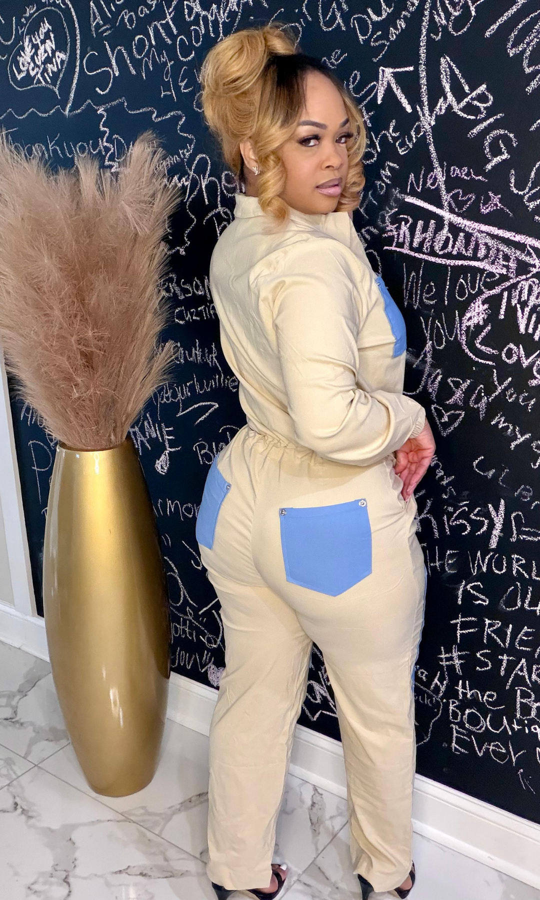 Side view of Kick Down Your Door Romper with contrast pocket detail