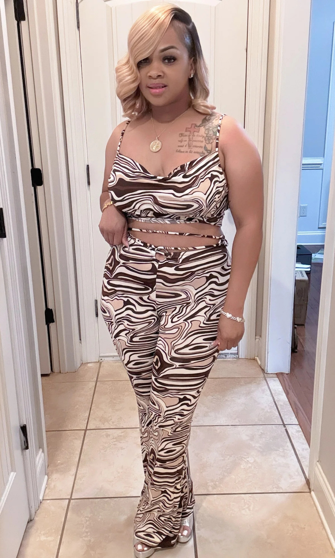 Model wearing the Kingdom Set from Envy Chic Couture, showcasing the flattering fit and wrap tie detail.