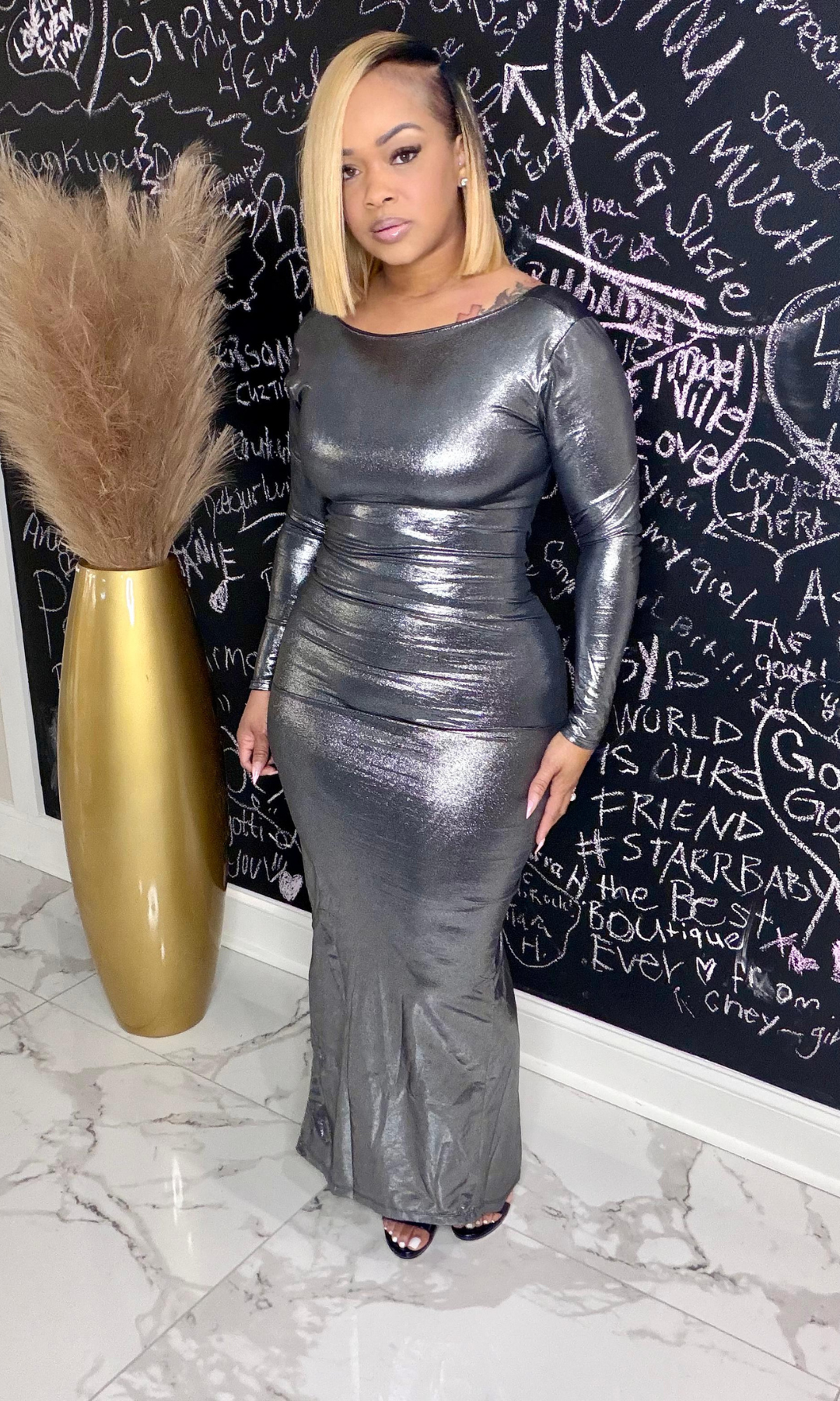 Woman wearing silver metallic long sleeve open back maxi dress – Magic Made Dress front view