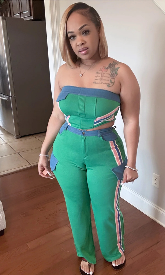 Woman wearing Mean Green Set two-piece with strapless striped tube top and wide-leg pants.