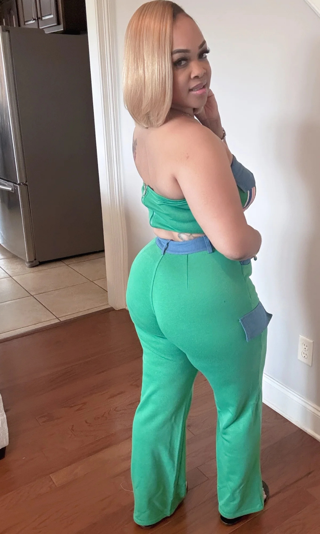 Back view of Mean Green Set highlighting stripe details and pocket accents.