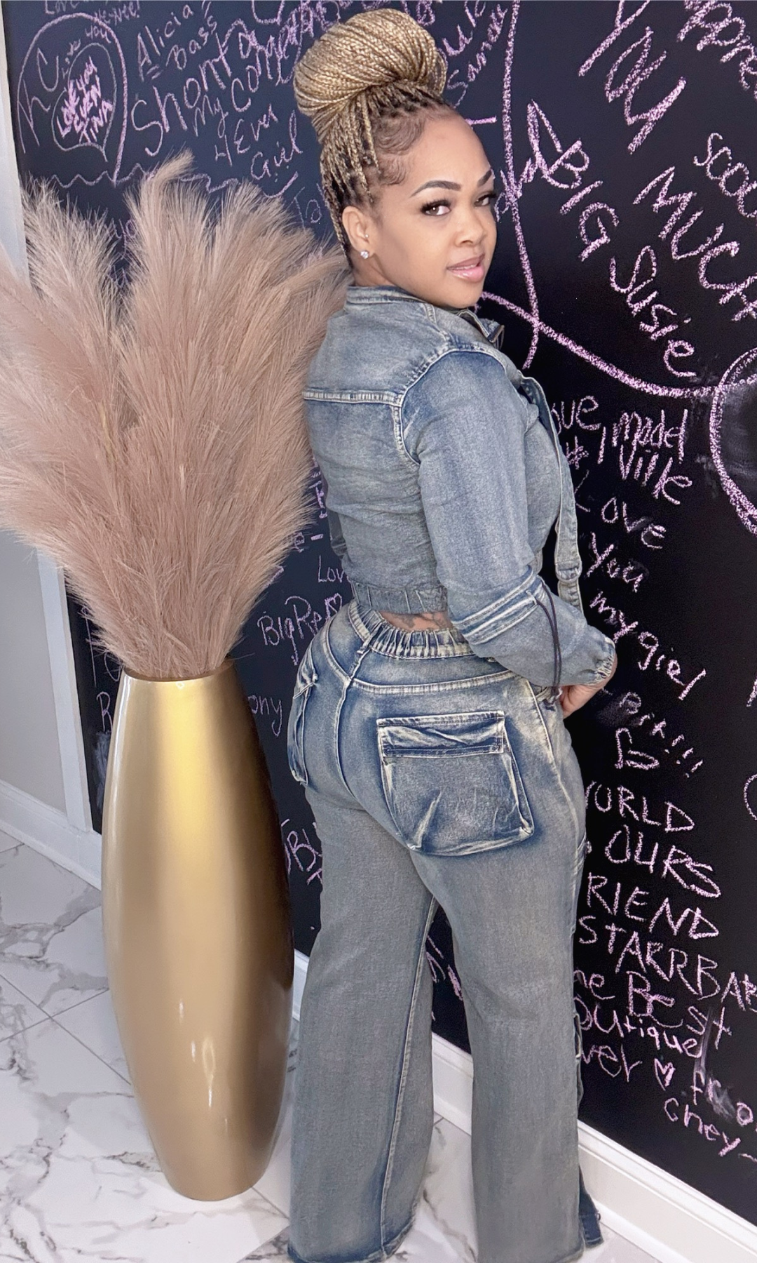 Woman wearing Motor Sport 2-piece jean set back view – denim crop jacket and high-waist jeans.