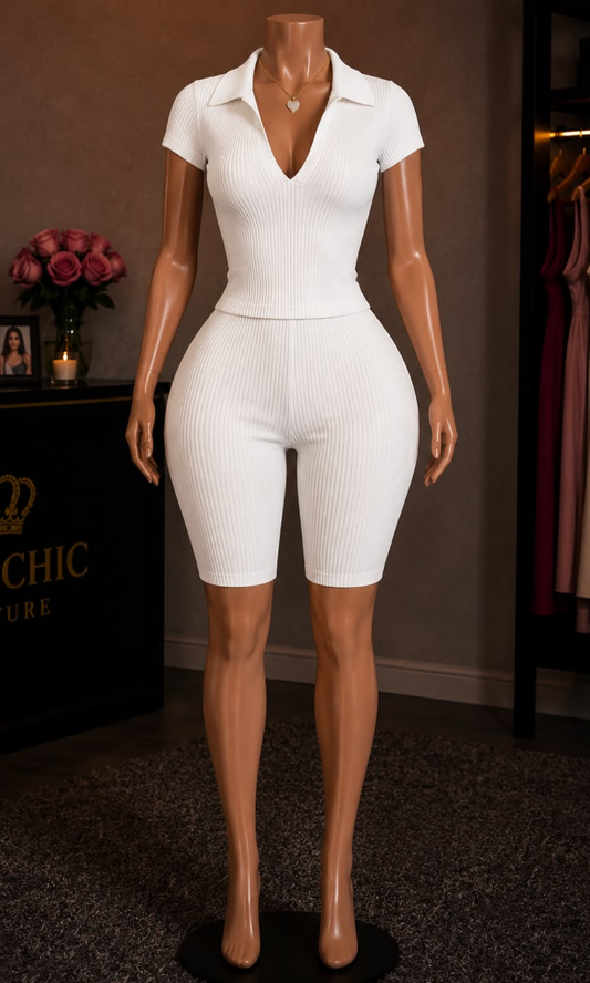 Women's off white two-piece matching set with a collared V-neck short-sleeve top and high-waisted biker shorts.