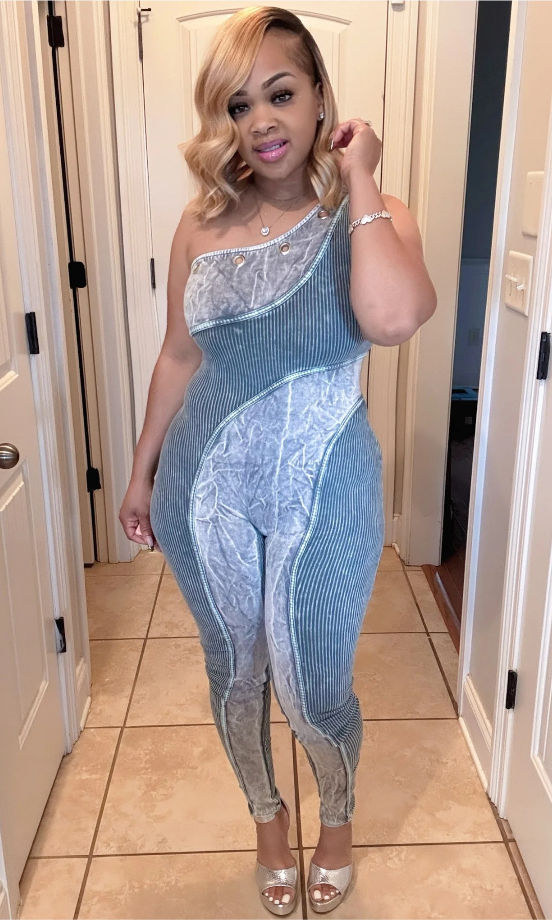 One Shoulder jumpsuit – close-up of neckline and top detail.