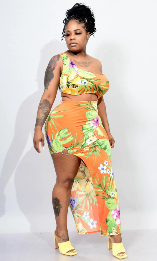 Model wearing the Orange Island Dress, front view, showcasing its vibrant orange color and flattering silhouette.