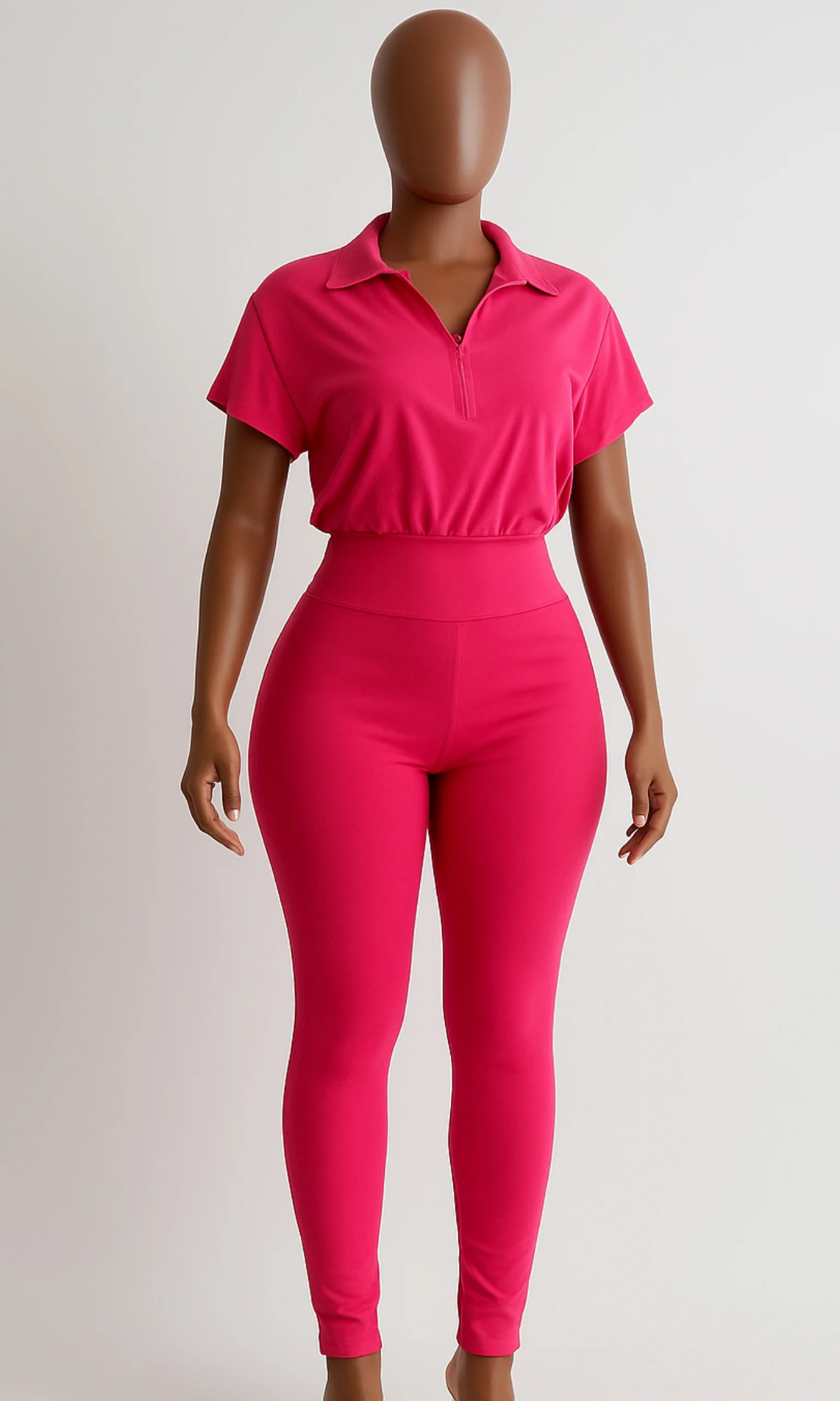 Front view of Perfection Fushia Jumpsuit with collared zip-front top and high-waist fit.