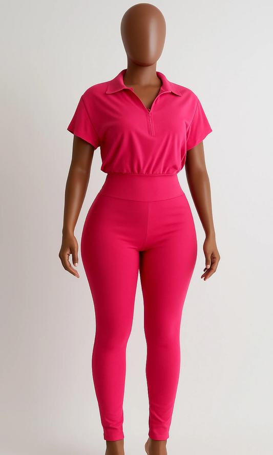 Front view of Perfection Fushia Jumpsuit with collared zip-front top and high-waist fit.