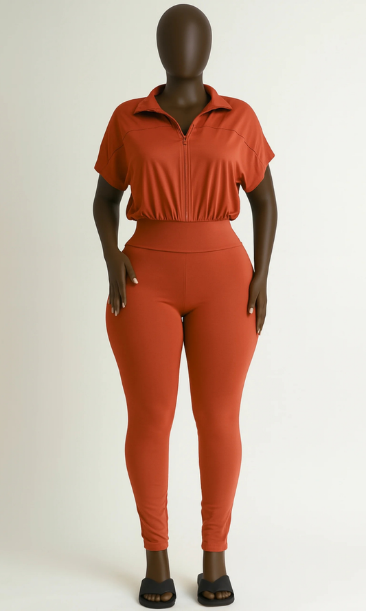 Front view of rust-colored short-sleeve jumpsuit on mannequin