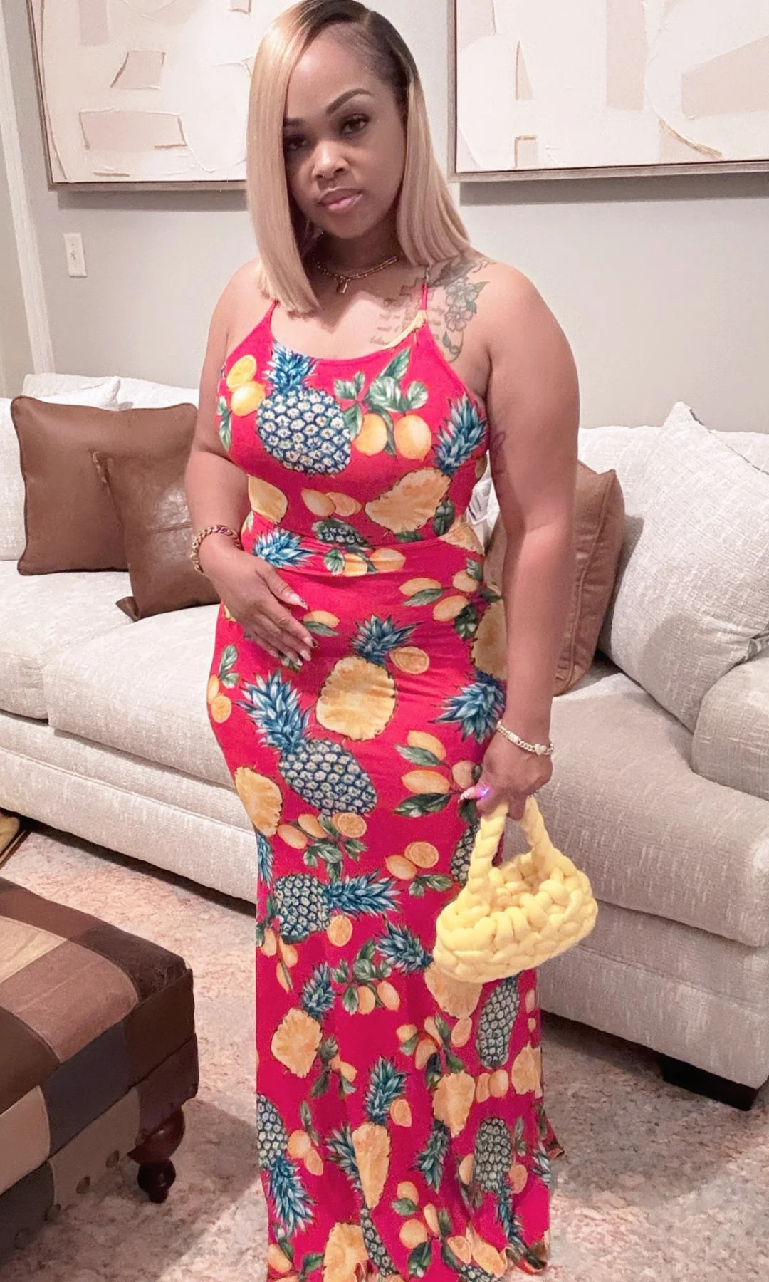 Front view of woman wearing tropical pineapple print maxi dress