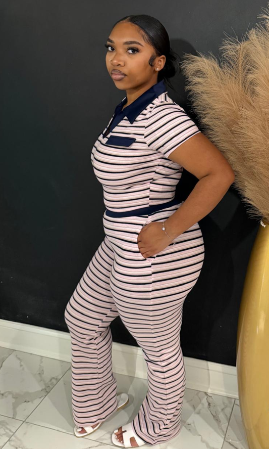 Woman wearing the Pink Affair striped two-piece set with a collared ribbed top and high-waisted flare pants.