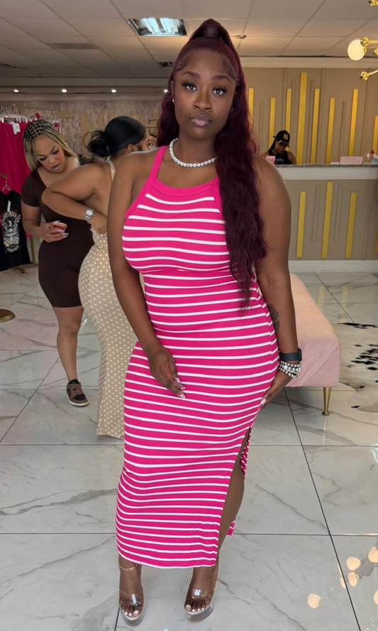 Woman wearing the Pink Basic Striped Maxi Dress featuring a racerback design, ribbed stretch fabric, and side slit.
