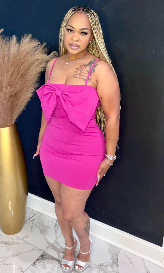 Pink bow sexy mini dress front view showing oversized bow detail and fitted silhouette