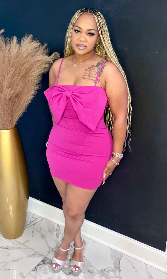Pink bow sexy mini dress front pose highlighting vibrant hot pink color and body-hugging fit