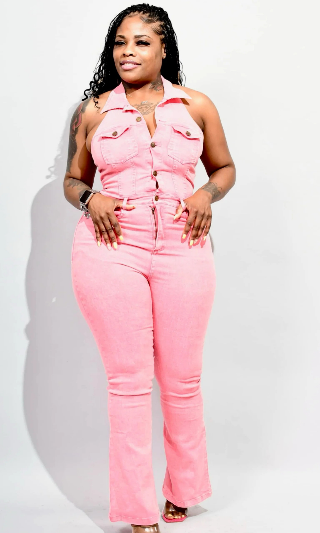 Front view of pink denim halter jumpsuit with button-down top