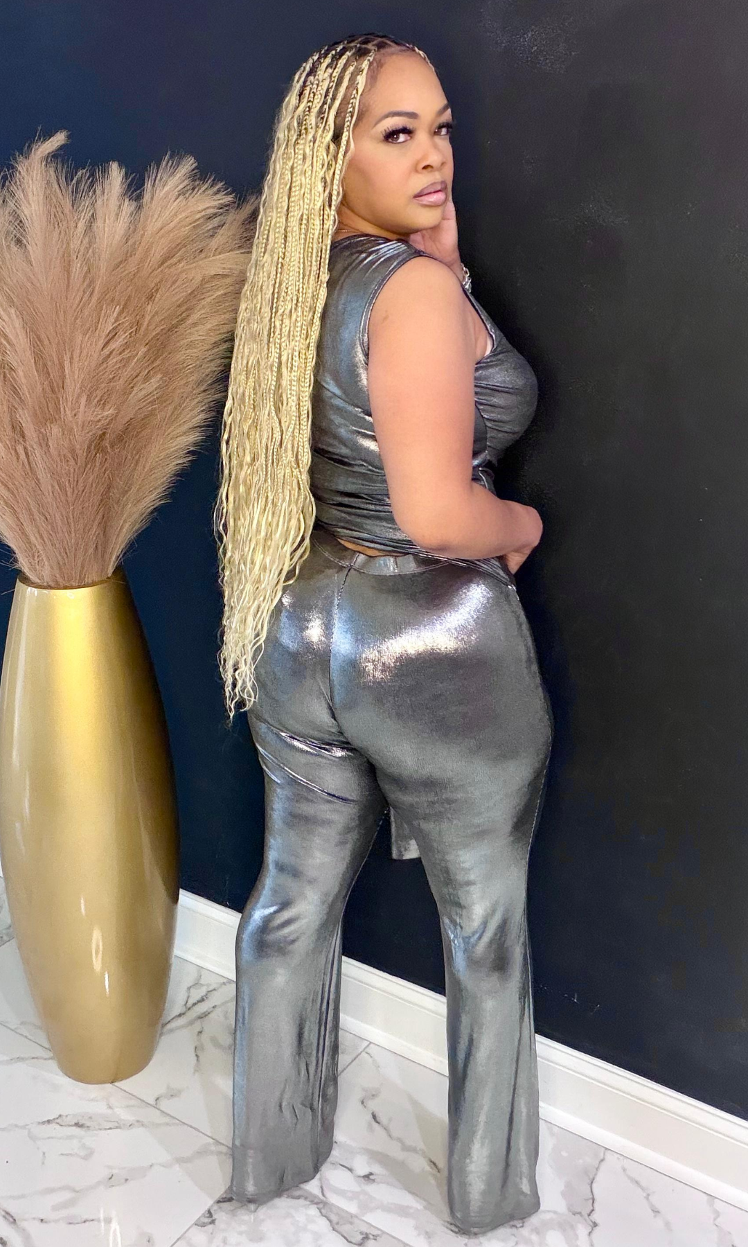 Platinum two piece set back view showing fitted pants and sleek metallic finish