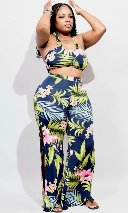 Woman wearing a tropical print outfit on a white background