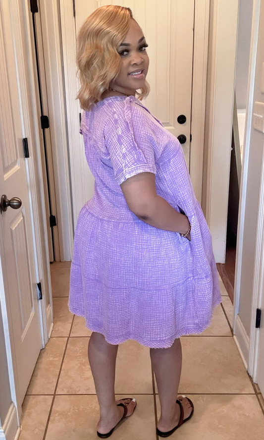 Back view of Purple Dress showcasing tiered design, relaxed fit, and short sleeves.