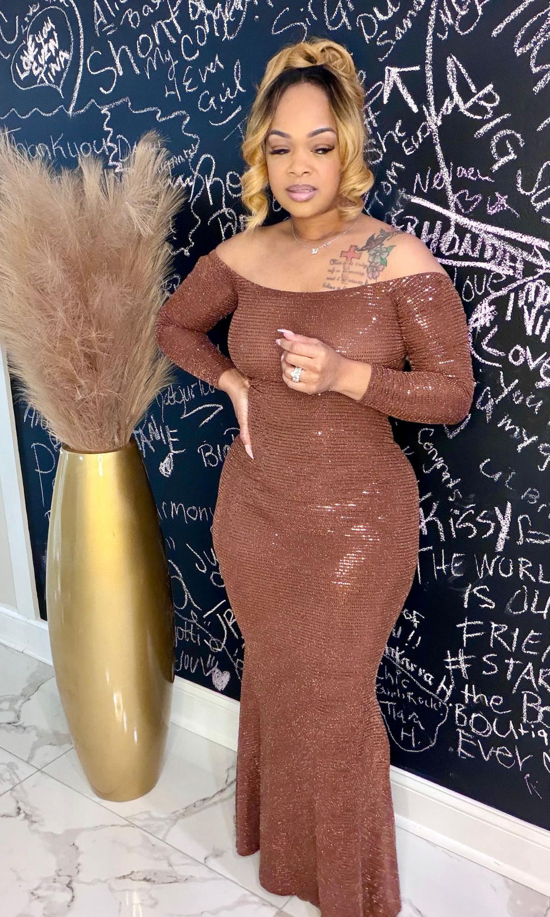 Front view of Queen Susie metallic bronze long sleeve gown