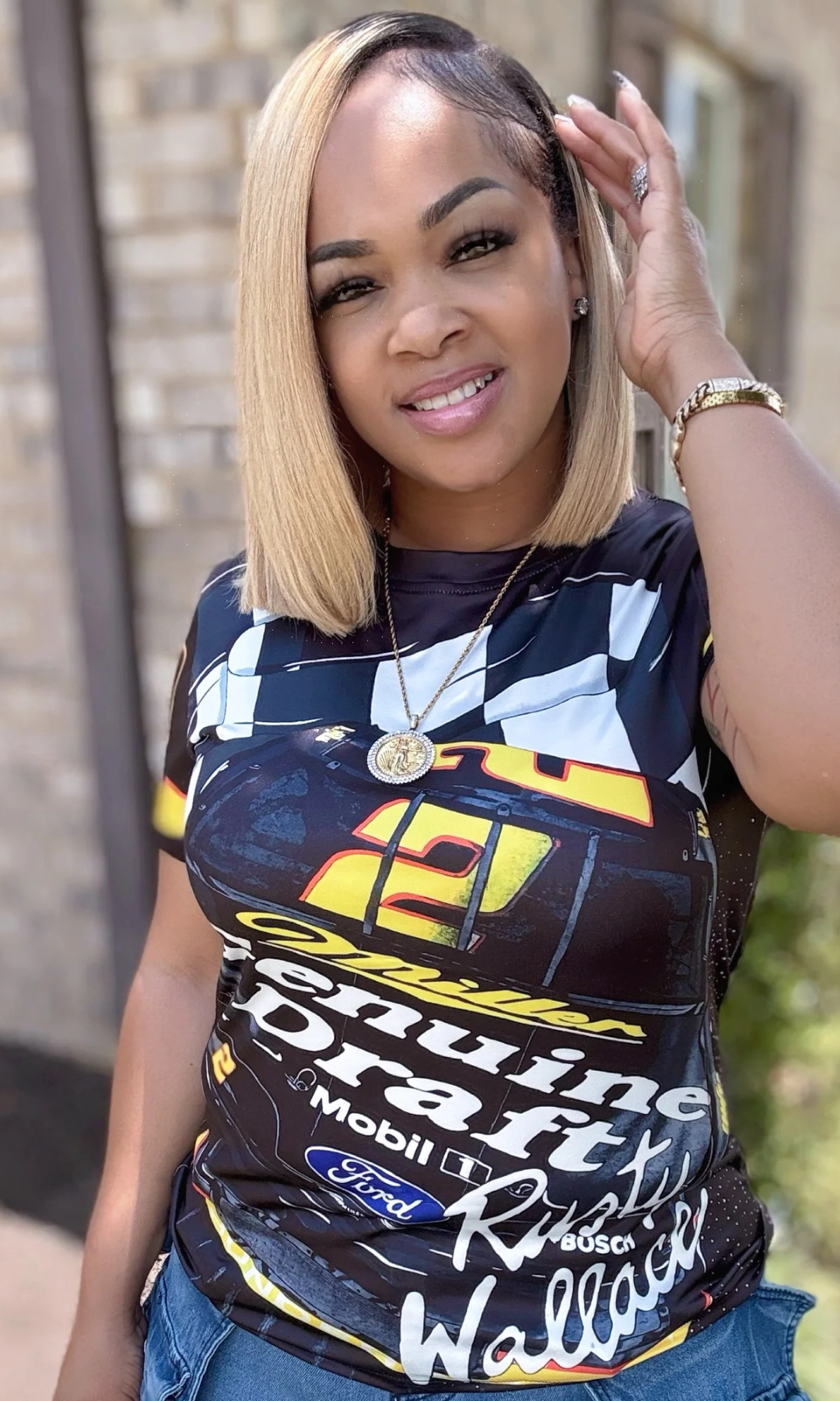 Close-up front view of Race Track T-Shirt with bold motorsport-inspired graphic in black, yellow, and white.